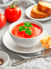 Bowl of tomato soup and toasted bread virtical frame