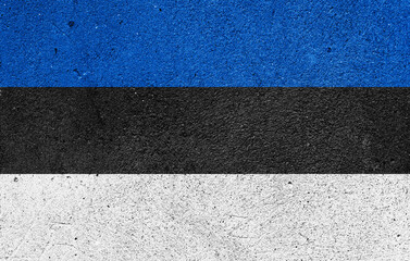 Fototapeta premium National flag of Estonia on a plastered wall