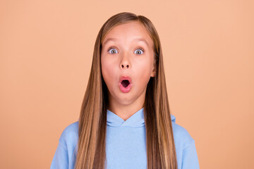 Photo of shocked confused person open mouth stare speechless cant believe isolated on beige color...