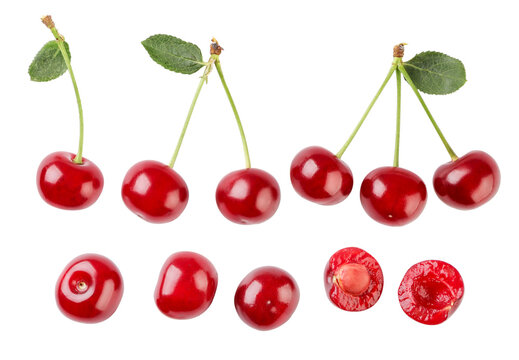 Set of ripe cherries with leaves, berries and a half close-up on a white background. Isolated