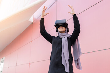 muslim woman in sportswear and virtual reality glasses - metaverse concept -
