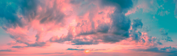 Fototapeta premium Panorama of a colorful cloudy sky at sunset. Sky texture. Abstract nature background