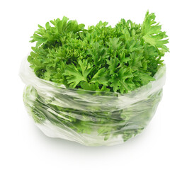 parsley in plastic bag isolated on white. greens grown in greenhouses.