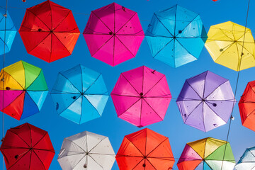 Colorful umbrellas background. Colorful umbrellas in the sky. Street decoration.