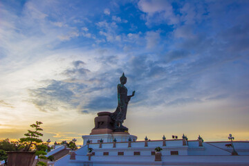 Phutthamonthon district,Nakhon Pathom Province,Thailand on AUG 1,2018:Sunset sky and Buddha statue at  Phutthamonthon