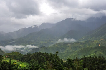 Morning fog,cloudy sky and mountain ranges in Sapa,Lao Cai Province,north-west Vietnam.