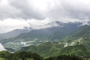 Fototapeta premium Morning fog,cloudy sky and mountain ranges in Sapa,Lao Cai Province,north-west Vietnam.