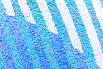 abstract spray graffiti art drawing on street city wall, texture of urban paint culture for design background