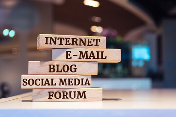 Wooden blocks with words 'Internet, e-mail, blog, social media, forum'. Internet concept.