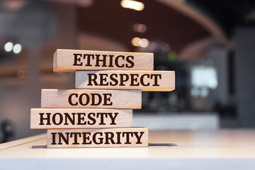 Wooden blocks with words 'ethics, respect, code, honesty, integrity'. code of conduct - obrazy, fototapety, plakaty