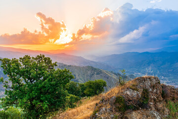 Mountain valley during sunset or sunrise. Natural spring or summer season landscape