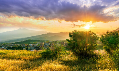 picturesque highland landscape with amazing view from hill with golden grass and green bushes