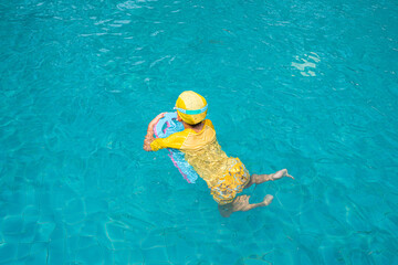 A boy try to swimming.