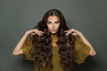 Attractive woman with long healthy hair and trendy makeup portrait
