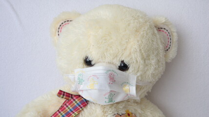 teddy bear wearing surgical mask