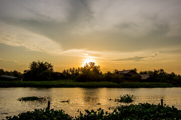 Golden sky above Tha Chin river(Maenam Tha Chin),Nakhon Pathom,Thailand during sunset
