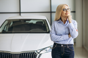 Portrait of sales woman in a car showroom