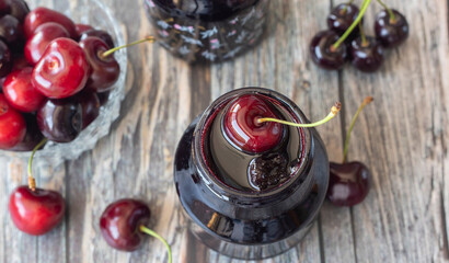 Jars with fresh homemade cherry jam