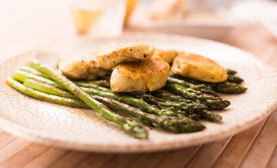 dietary meal rich in protein. Stir fried chicken breast and green asparagus