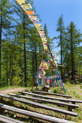Buddhist place in Buryatia on hill above confluence of Black and White Irkut rivers with colored...
