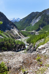 Top view of the Black Irkut riverbed in a mountain gorge on a summer day. Nuhu pass, Mondy-Orlik road, Buryatia. Beautiful mountain landscape. Natural background. Summer travel concept