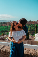 Naklejka premium beautiful couple in love sitting with nice background