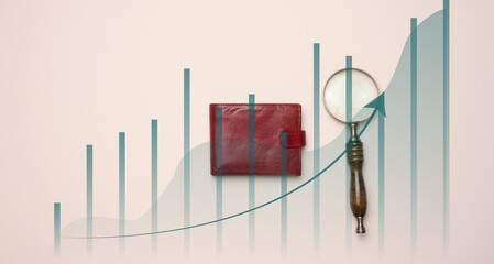 magnifying glass, leather wallet and a graph with growing indicators on a beige background