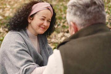 Elegant adult couple in a spring forest