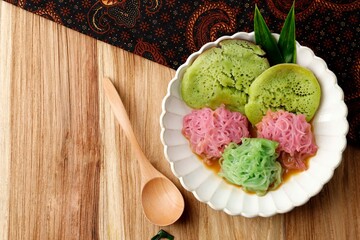Top View Pethulo, Srabi and Putu Mayang Served with Coconut Milk Palm Sugar Syrup, Traditional Indonesian Dessert from East Java.