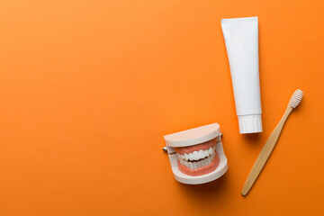 Mouthwash and other oral hygiene products on colored table top view with copy space. Flat lay....