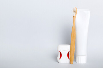 toothpaste and toothbrush top view with copy space on colored background. Flat lay. Dental hygiene....