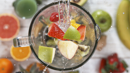 Fresh fruit and vegetables smoothie blended in blender, top view. Healthy eating concept.