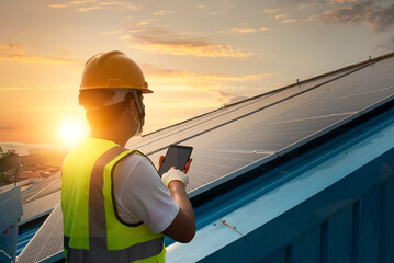 Technician inspecting solar panel maintenance on hospital roof, solar panel maintenance view