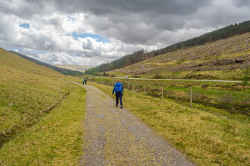 Fototapeta na wymiar Walkers on the West Highland Way between Tyndrum and the Bridge of Orchy.