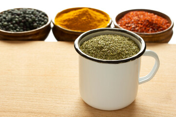 Types of spices. Roasted terebinth fruits. Thyme. Turmeric. Red powdered pepper.