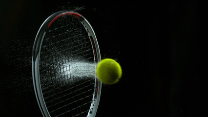 Freeze Motion Shot of Racket Hitting Tenis Ball Containing Whte Powder - obrazy, fototapety, plakaty