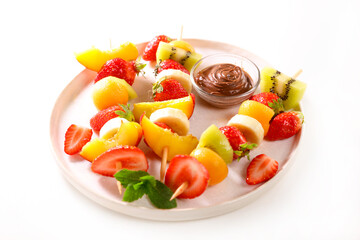 fresh juicy fruit skewer and chocolate sauce