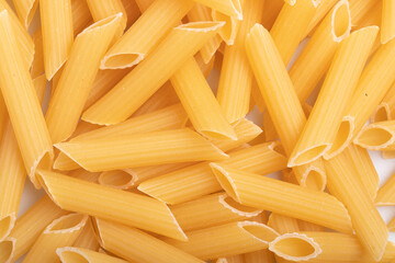 uncooked Penne rigate macaroni for background..Close up