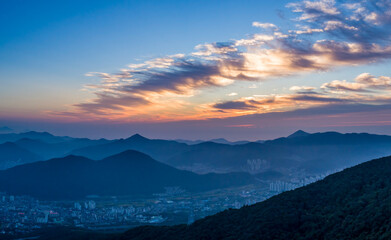 Naklejka na ściany i meble Scenic view of mountains against sky during sunrise