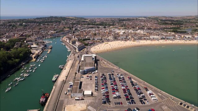 Aerial Time Lapse of Weymouth Harbour, Beach and Town in Dorset on a Sunny Day