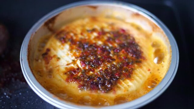 Cheese on the grill. Close-up of whole grilled cheese, selective focus