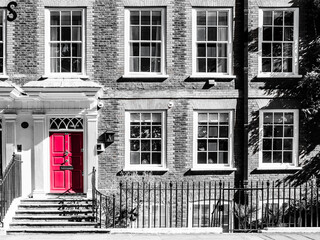 Georgian residential building desaturated with Red door