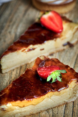 Tartlets with chocolate, strawberry , bundt cakes, on the wood table.
Tasty homemade caramel cheesecake.