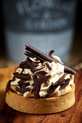 Tartlets with chocolate, strawberry , bundt cakes, on the wood table.
Tasty homemade caramel cheesecake.