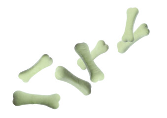 Bone shaped cookies for dogs falling on white background