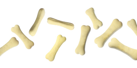 Bone shaped cookies for dogs falling on white background