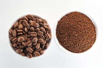 Roasted coffee whole and ground beans in bowl isolated close up on white background