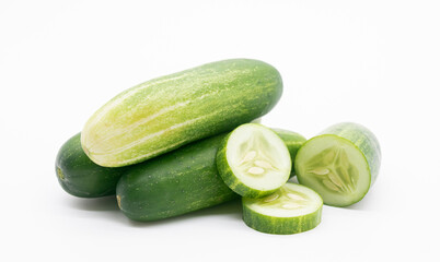 whole cucumber with some pieces isolated on white background.fresh vegetable for salad