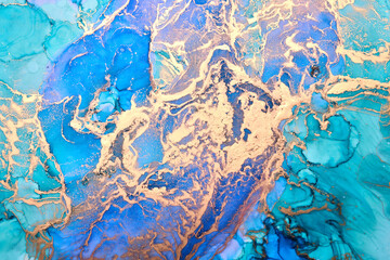 Blue golden ink luxury abstract background, colorful marble texture, fluid art pattern wallpaper, paint mix underwater wavy spots and stains