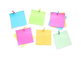 Blank colorful notes pinned on white background, top view. Space for text